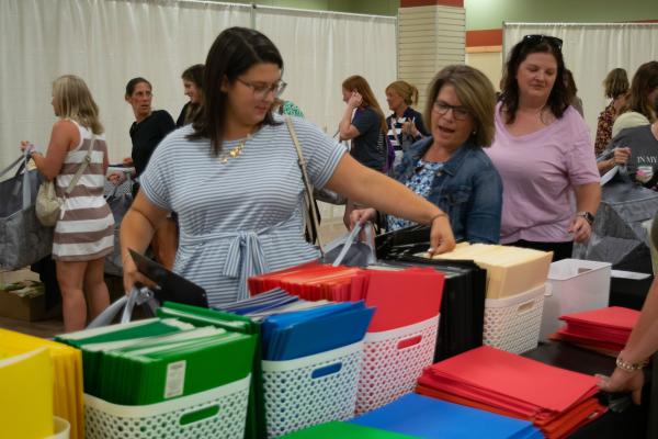 People looking at folders